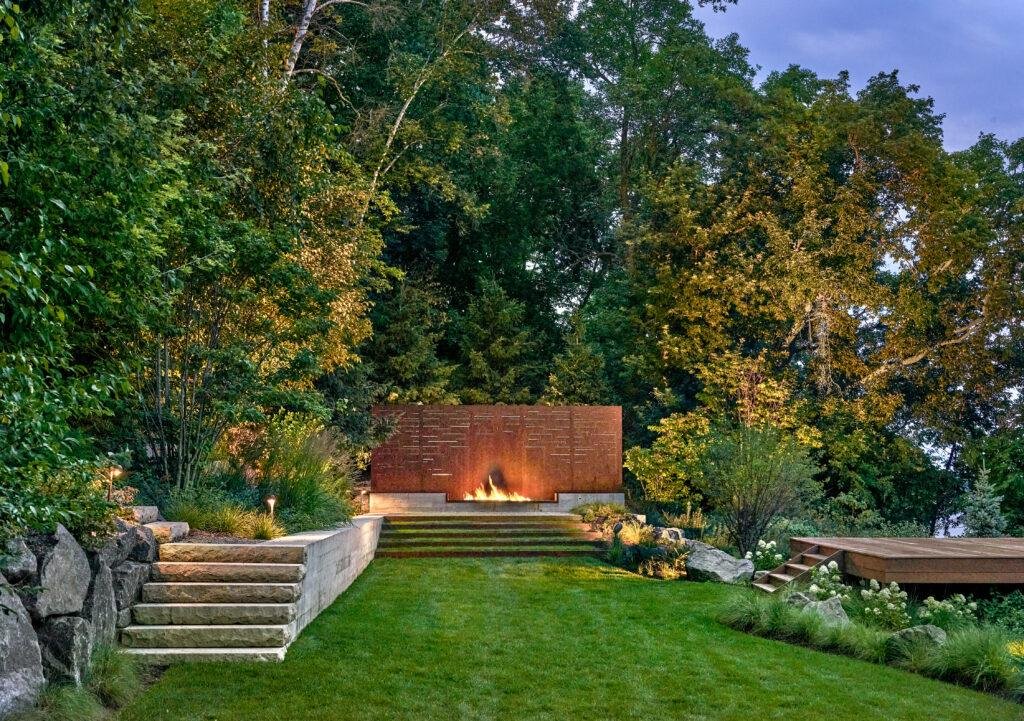 Outdoor lighting highlighting backyard features.